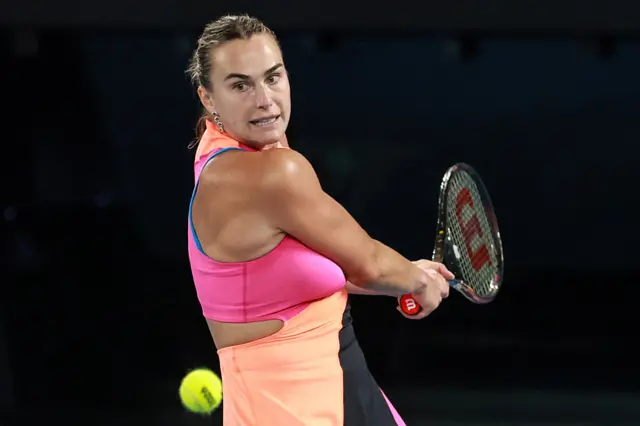 Aryna Sabalenka hits a backhand