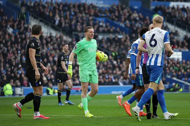 Pickford shouts after gathering the ball