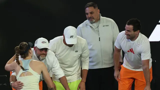 Elena Rybakina is congratulated by her coaching staff