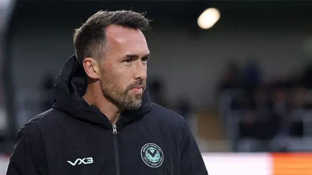 Christian Fuchs watches from the sidelines