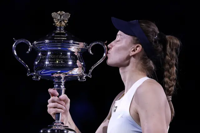 Elena Rybakina kisses the trophy