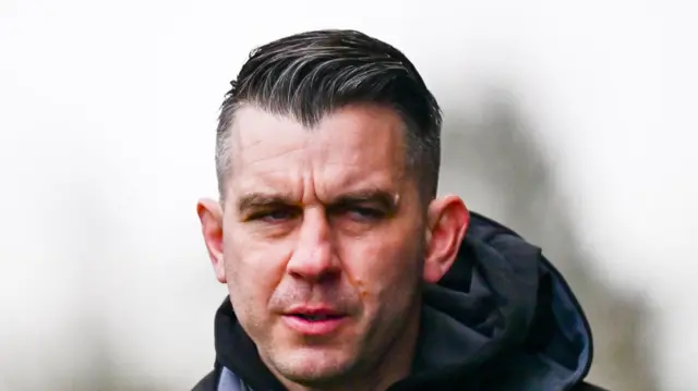 Oxford United boss Matt Bloomfield looking on.