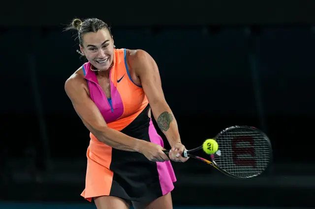 Aryna Sabalenka plays a backhand