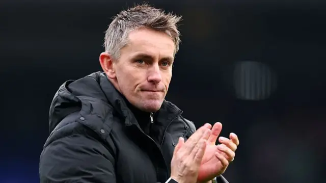 Ipswich Town boss Kieran McKenna applauding the fans.