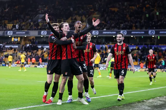 Alex Scott celebrates with his teammates