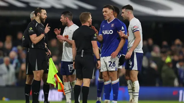Ipswich defender Dara O'Shea tries to make his point to referee John Busby
