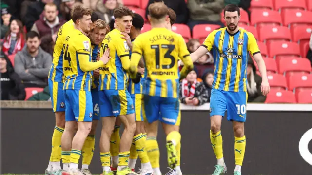 Southampton players celebrate Flynn Downes' goal at Stoke