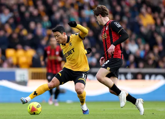 Hwang dribbles through midfield