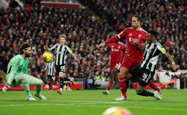 Alisson saves from Willock