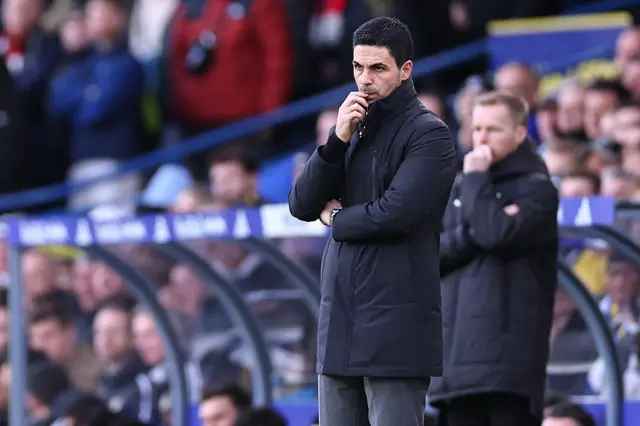 Arteta stands with a furrowed brow on the touchline