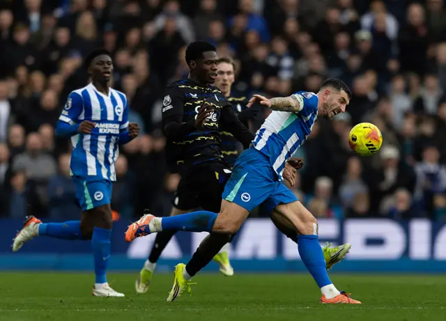 Lewis Dunk of Brighton & Hove Albion battles for the ball with Thierno Barry
