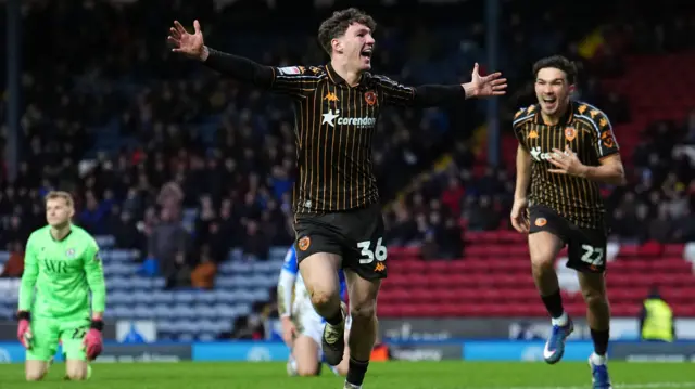 Lewis Koumas celebrates with his arms wide open