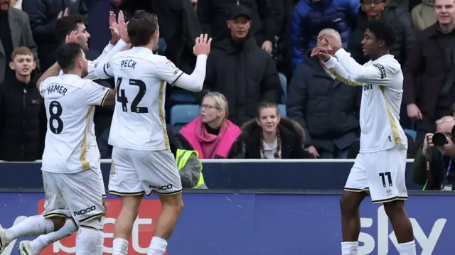 Andre Brooks celebrates with his Sheffield United team-mates