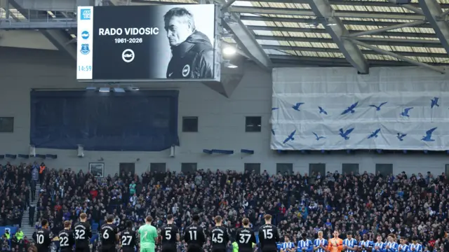 Brighton and Eveton players lead a moments' silence