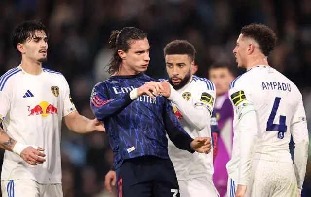 Arsenal and Leeds players square up