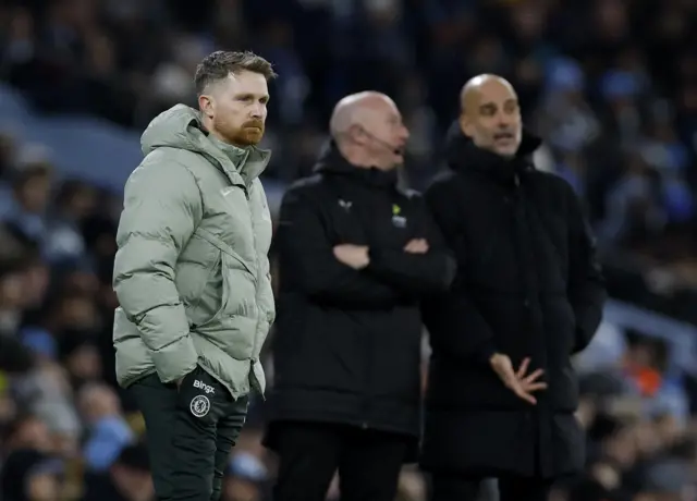 Chelsea interim manager Calum McFarlane looks on as Manchester City manager Pep Guardiola