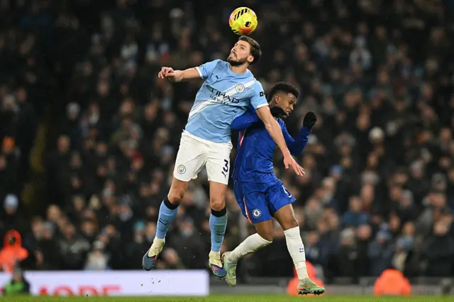 Manchester City's Portuguese defender #03 Ruben Dias (L) vies with Chelsea's Brazilian midfielder #41 Estevao