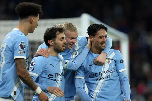 Nico O'Rilley, Bernardo Silva, Erling Haaland and Tijjani Reijnders of Manchester City celebrate 1st goal