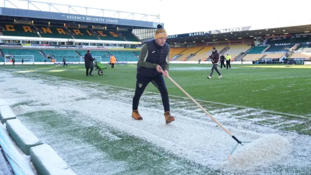 Norwich groundstaff clear snow