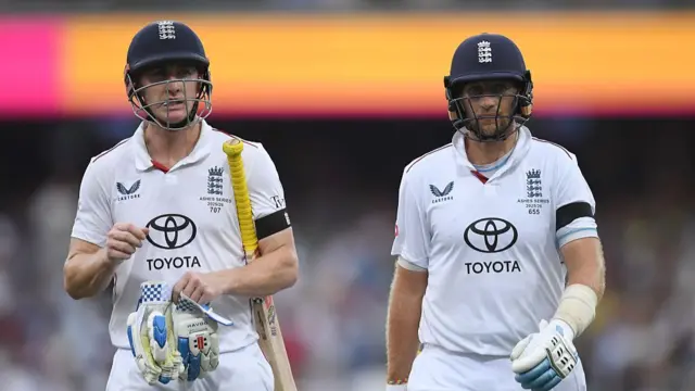 Harry Brook and Joe Root leave the field
