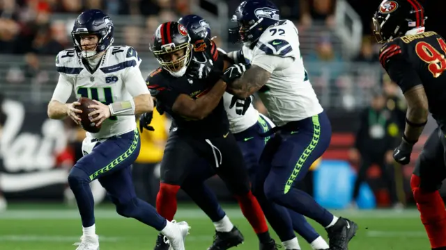 Seattle Seahawks quarterback Sam Darnold rushes the ball against the San Francisco 49ers