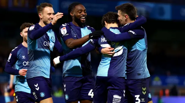Wycombe players celebrate a goal
