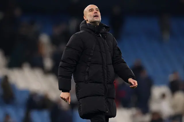 Pep Guardiola, Manager of Manchester City, reacts