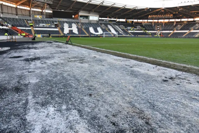 Ice can be seen around the perimeter of Hull City's pitch before the game with Watford which was called off