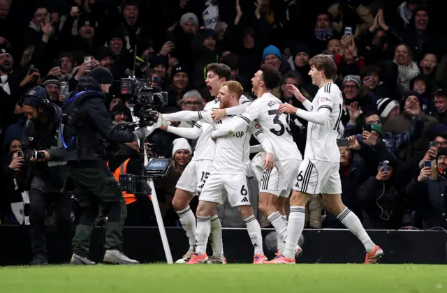 Fulham's Harrison Reed celebrates scoring their second goal with teammates