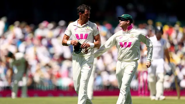 Mitchell Starc of Australia is congratulated by Steve Smith