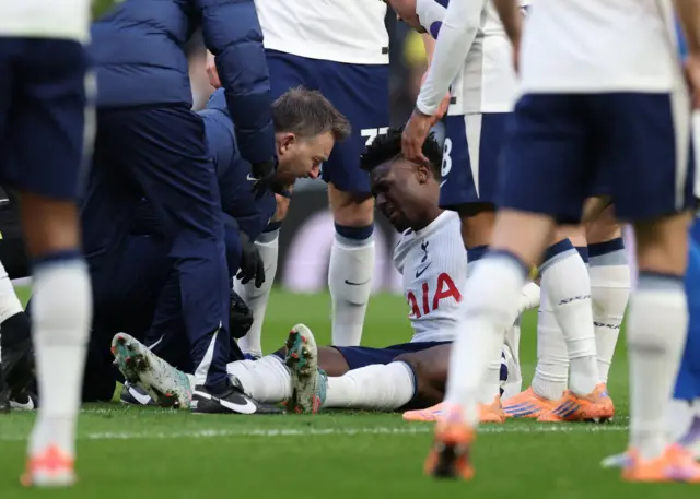 Tottenham Hotspur's Mohammed Kudus receives medical attention