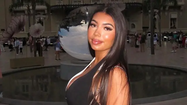 Headshot of Miah Sanchez who turns to look at the camera