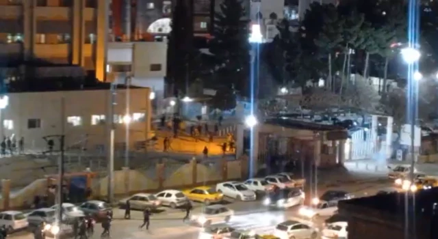Security forces outside a hospital in Ilam, where a rally took place
