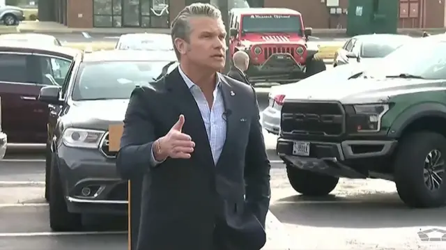 Hegseth speaking to new recruits in the parking lot of a enlistment ceremony in Virginia