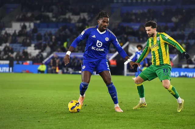Caleb Okoli of Leicester City with Mikey Johnston of West Bromwich Albion
