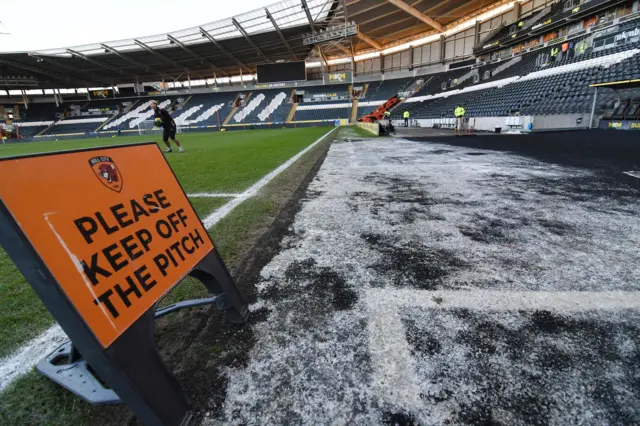 Ice in front of the players dugouts cause the match to be postponed