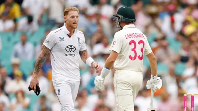 Marnus Labuschagne of Australia and Ben Stokes of England