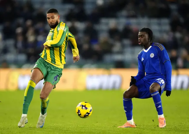 West Bromwich Albion's George Campbell (left) and Leicester City's Jeremy Monga battle for the ball