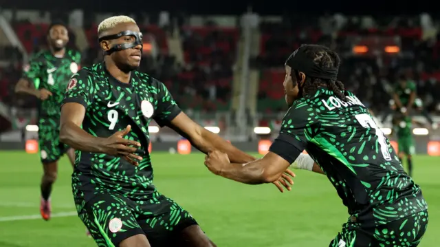 Victor Osimhen and Ademola Lookman celebrate a goal for Nigeria