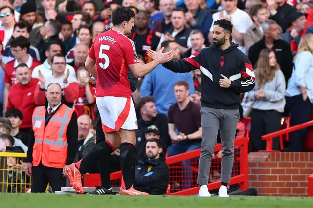Former Manchester United head coach / manager Ruben Amorim embraces Harry Maguire