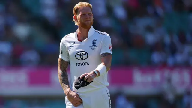 Ben Stokes of England reacts to an injury during day four