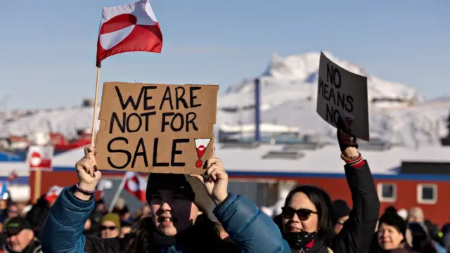 Protesters gather in front of the U.S. consulate during a demonstration, under the slogan, "Greenland belongs to the Greenlandic people", in Nuuk, Greenland