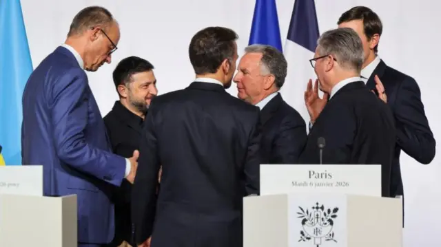 Merz, Zelensky, Macron, Witkoff, Starmer and Kushner all stand together