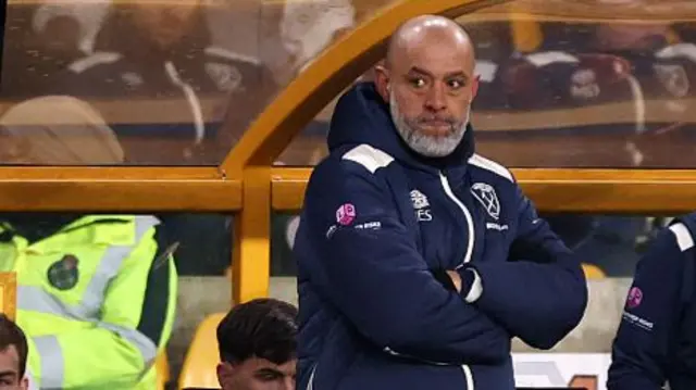 Nuno Espirito Santo stood with arms crossed in the dugout at Wolves