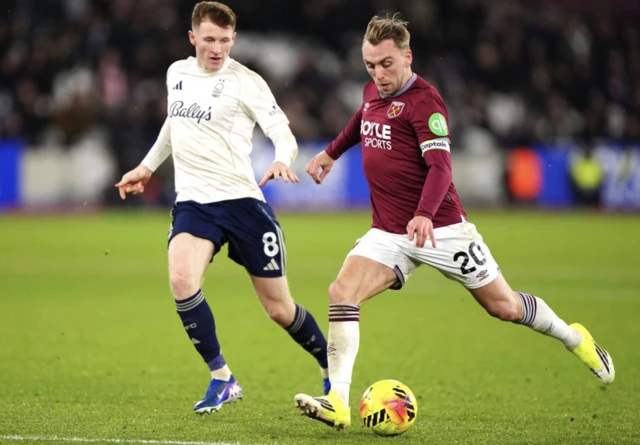 West Ham United's Jarrod Bowen (right) attempts a shot towards goal
