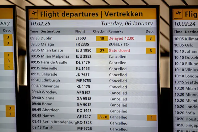Departures board shows cancelled flights at Schiphol