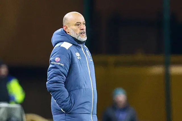Nuno Espirito Santo standing on the sideline with his hands in his pockets