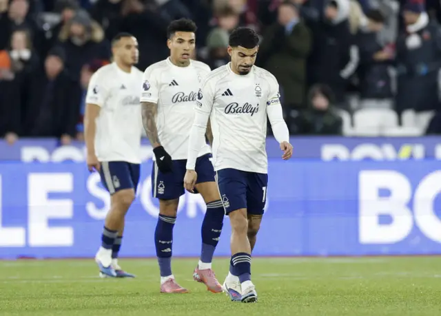 Forest players trudge back to kick off after concesing