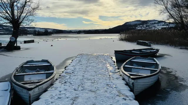 Boats on a frozen jetty in Wales