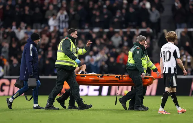 Fabian Schaer of Newcastle United is stretchered off